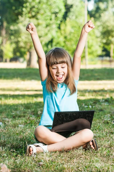 Little girl with laptop — Stock Photo, Image