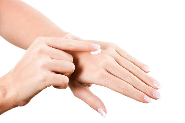 Female hands applying moisturizer — Stock Photo, Image