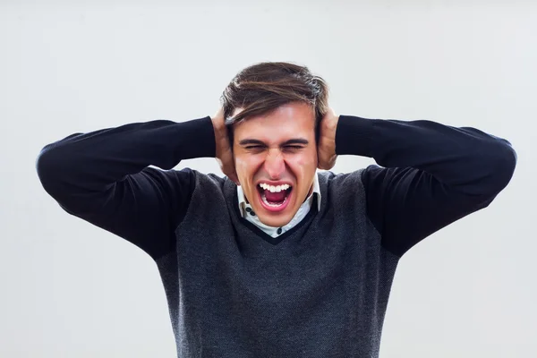 Frustrated businessman is covering his ears — Stock Photo, Image