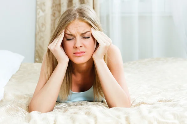 Woman is having a headache — Stock Image Woman is having a headache Stock Photo