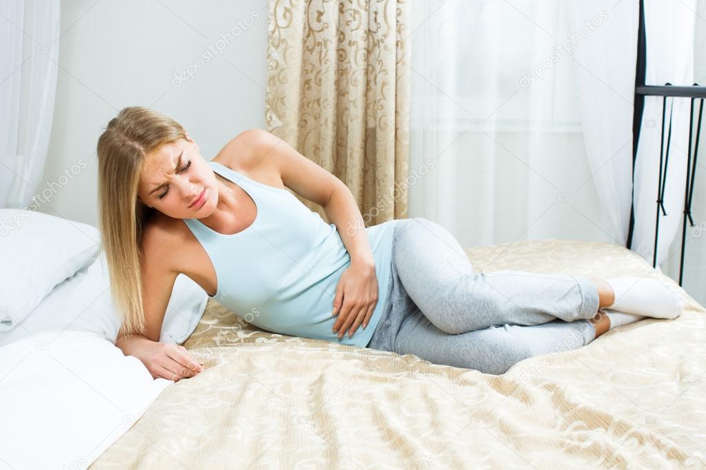 Woman having pain in stomach