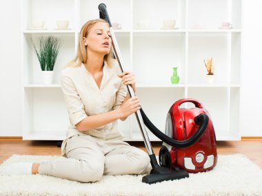 Beautiful housewife with vacuum cleaner clipart