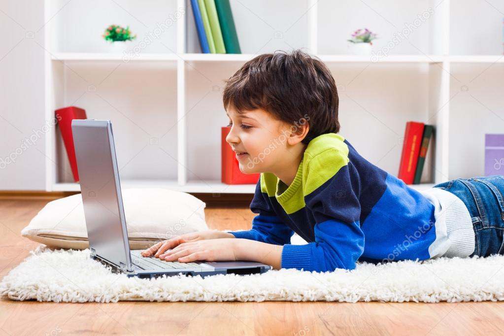 Little boy using laptop