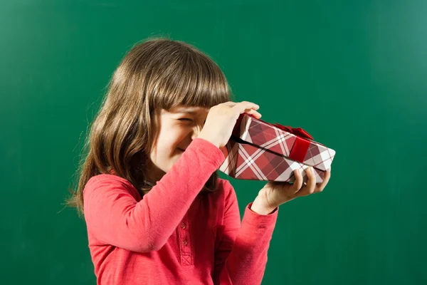 Little girl with gift — Stock Photo, Image