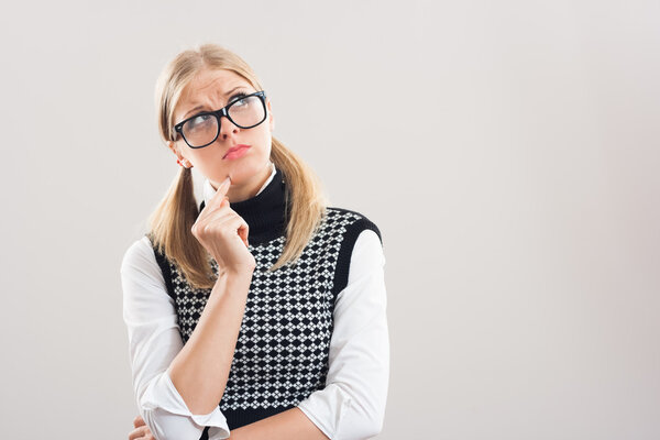 Nerdy woman is thinking about something