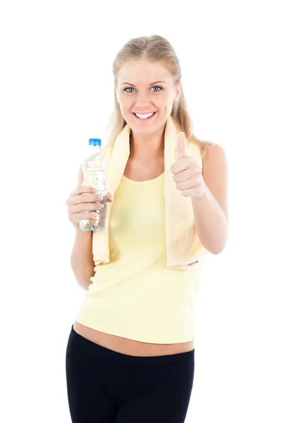 Jonge vrouw met water na fitness oefening — Stockfoto