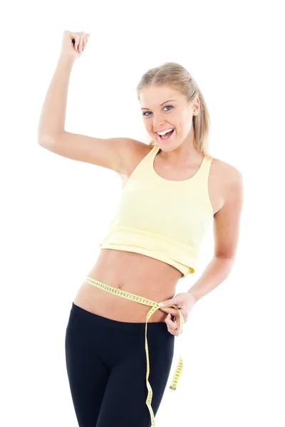 Mujer joven midiendo el vientre después de la dieta — Foto de Stock