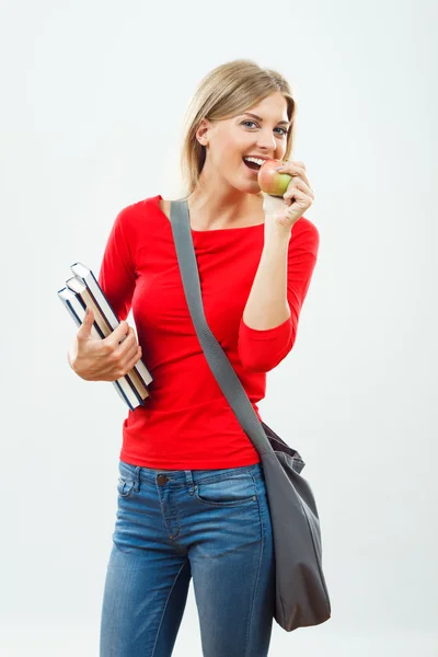 Estudante menina comer maçã — Fotografia de Stock