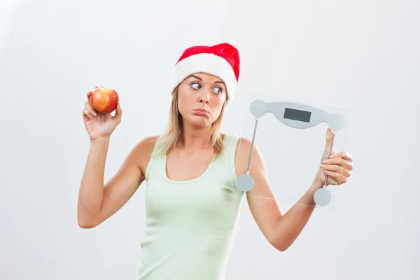 Santa vrouw met schaal en apple — Stockfoto