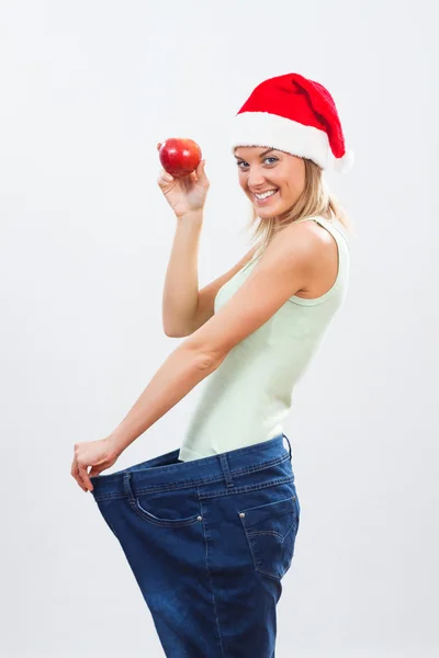 Santa vrouw met rode appel — Stockfoto