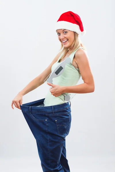 Santa vrouw in grote broek — Stockfoto