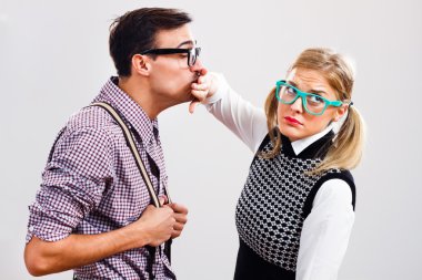man trying to kiss woman clipart