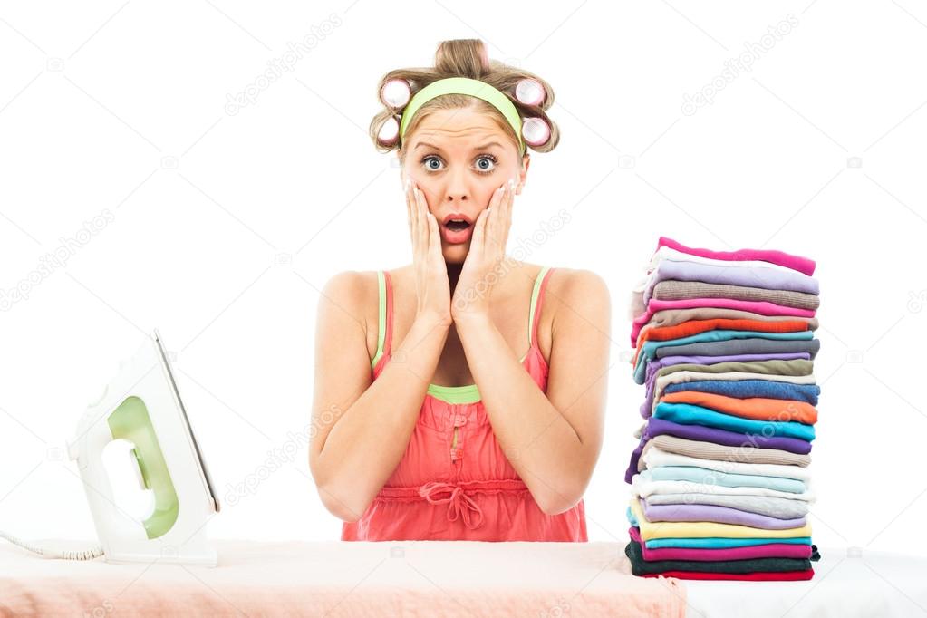 Sad Housewife ironing laundry