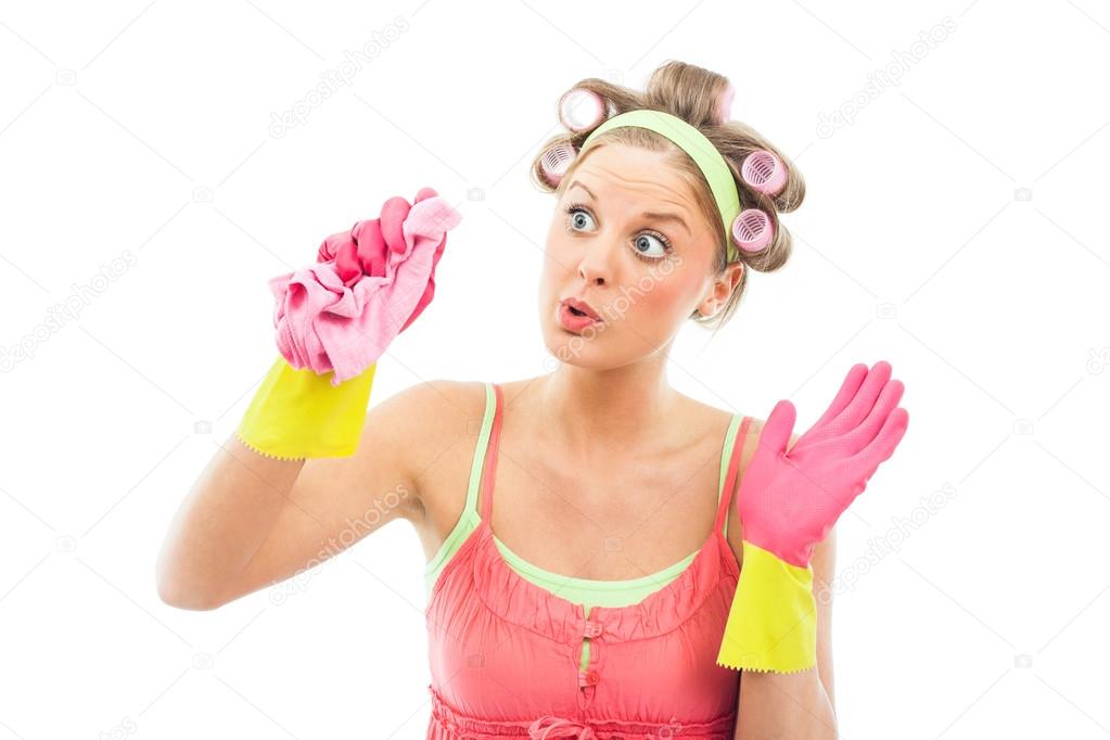 housewife cleaning glass or window
