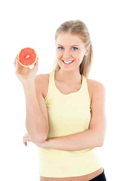 Jonge vrouw bedrijf greapfruit — Stockfoto