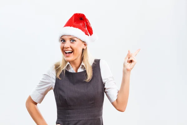 Weihnachtsmann Frau zeigt auf etwas — Stockfoto