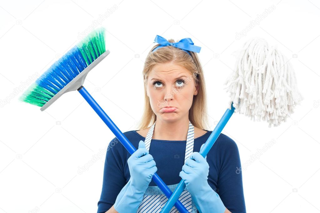 young housewife with broom and mop