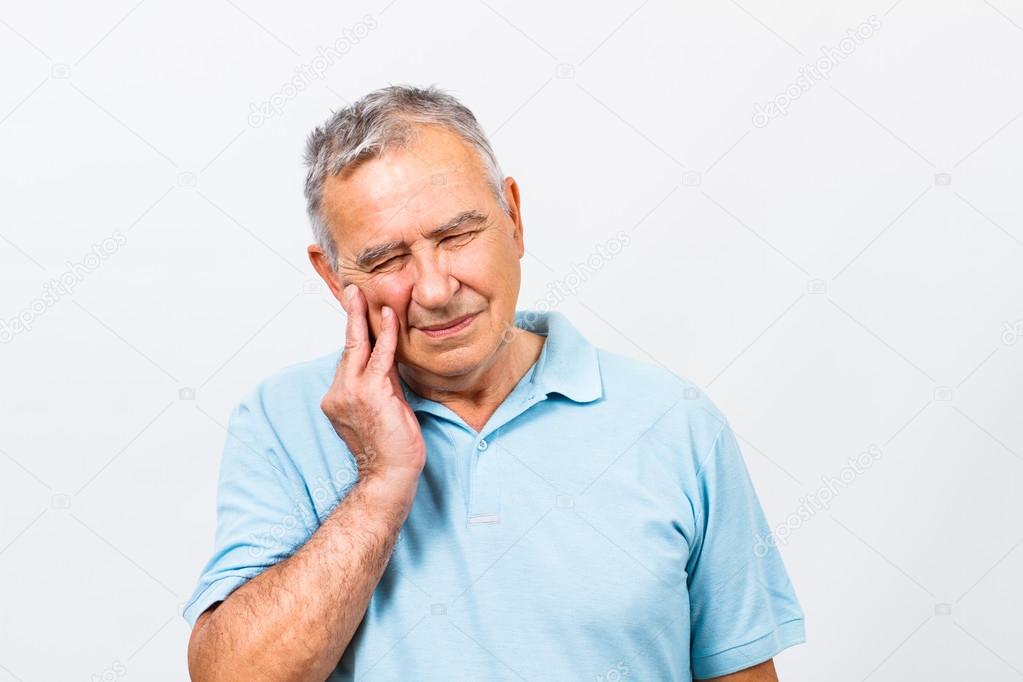 senior man having tooth ache