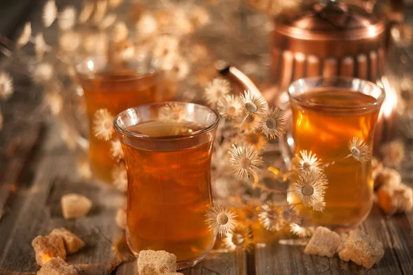 Tea and dry flowers — Stock Photo, Image