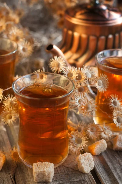 Tea and dry flowers — Stock Photo, Image