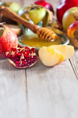Pomegranate, apples and honey background clipart