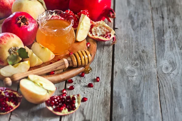 Granatäpple, äpplen och honung bakgrund — Stockfoto