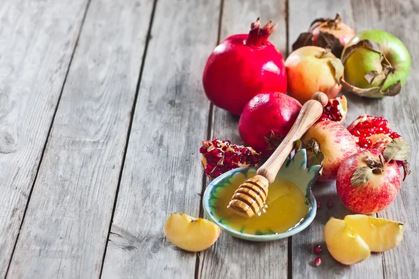 Granatäpple, äpplen och honung bakgrund — Stockfoto