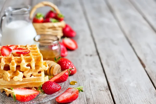 Waffles with strawberry abd honey background — Stock Photo, Image