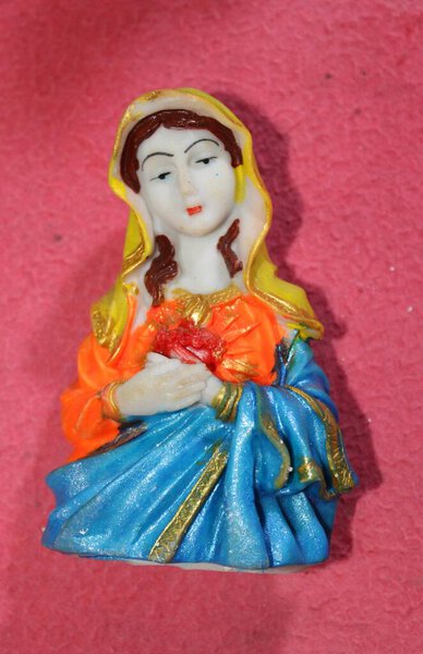 mother merry statue with pink colour background. Mary was a first-century Galilean Jewish woman of Nazareth, the wife of Joseph, and the mother of Jesus, according to the canonical gospels and the Quran.