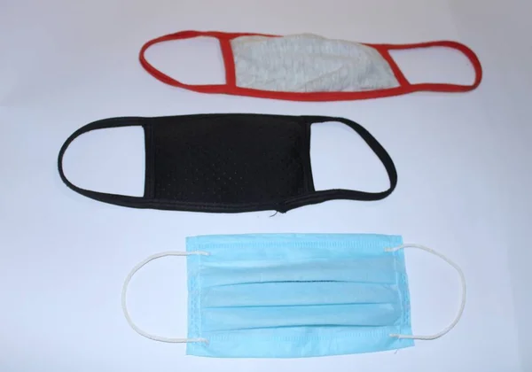 surgical mask, cotton mask wit white colour background. three colorful mask with coronavirous protected mask.