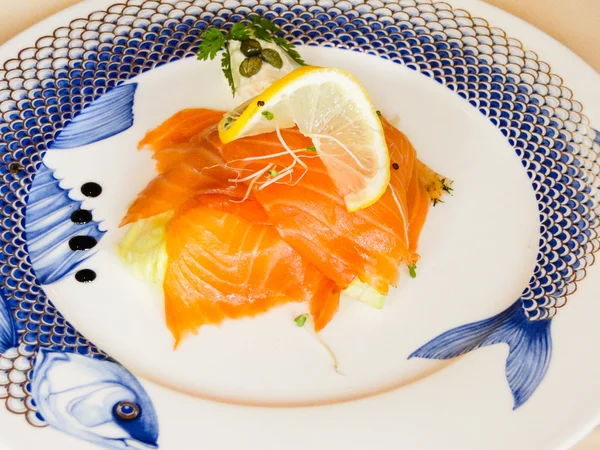 Smoked salmon nicely presented on a plate — Stock Photo, Image