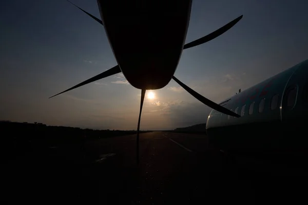 Aircraft propeller. Outside view. Sunset and plane.