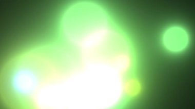 Kibar yeşil rengin video arkaplanı. Yuvarlak, beyaz ve sarı bokeh projeleriniz ve çalışmalarınız için güzel bir ışık zemin oluşturur..