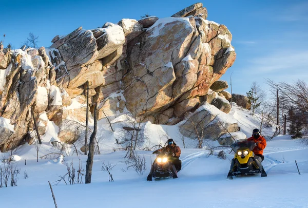 Athletes on a snowmobile — Stock Photo, Image