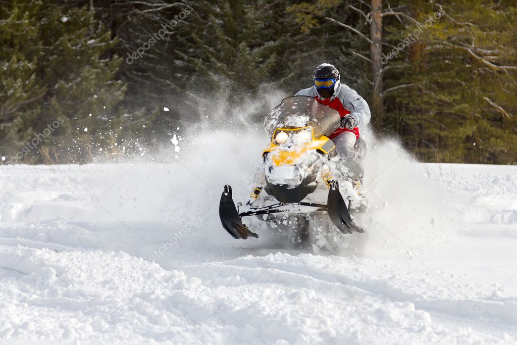 Athlete on a snowmobile.