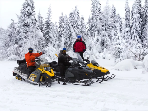 Athletes on a snowmobile — Stock Photo, Image
