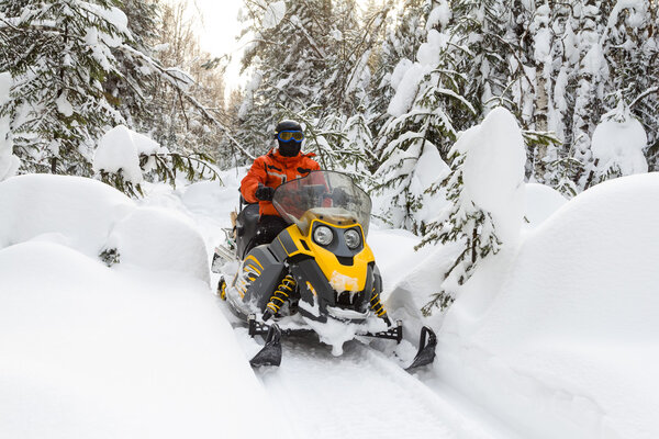 Athlete on a snowmobile.