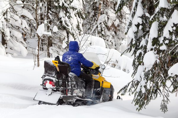 Woman on a snowmobile