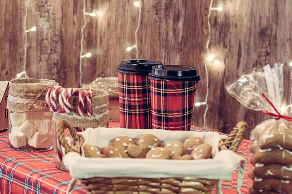 Christmas, New year pastry shop. Gingerbread, marshmallows, cookies, sweets hot chocolate and coffee on the counter in a small cozy cafe. Homemade bakery — Stock Image Christmas New Year Pastry Shop Gingerbread Marshmallows Cookies Sweets Hot Royalty Free Stock Photos