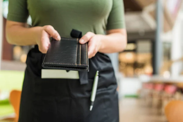 Cropped Image Woman Waitress Apron Hold Out Bill Folder Cafe — Stock Photo, Image