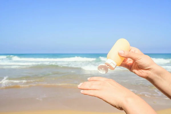 Woman Applying Sunscreen Skin Hand Beach Coastline Sea Female Relaxation — Stock Photo, Image