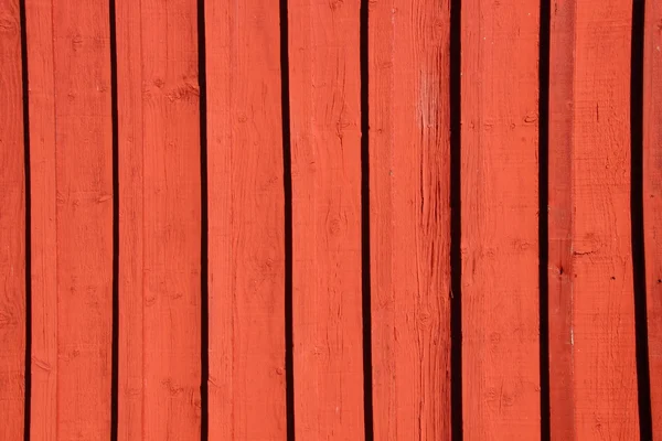 Red painted wooden worn wall of plank background — Stock Photo, Image