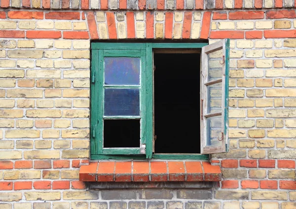 Open window with green frame and missing glass — Stock Photo, Image