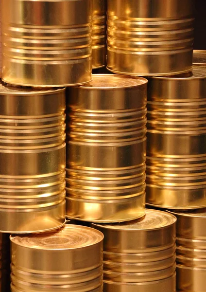 Vertical stack of golden metal food can background — Stock Photo, Image