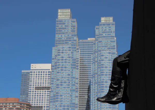 Resting Black Leather Boots with Skyscraper Background — Stock Photo, Image