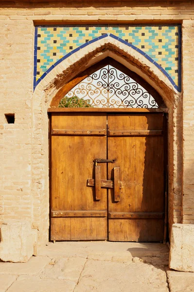 Intricate islamic wood crafted door design, Islamic design carved on wooden door. museum of Haft Tanan ,shiraz , Iran