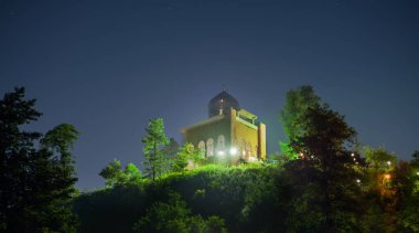 rasht, galan-iran- july 27 2021 the mosque or memorial called Imamzadeh Eshaq at night, gilan province, iran clipart