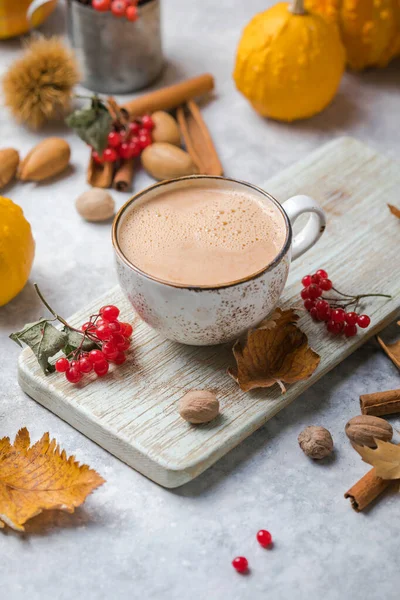 Pumpkin latte in mug. Autumn drink for Halloween or Thanksgiving.