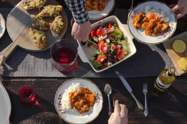 top view of family eating at table at daytime