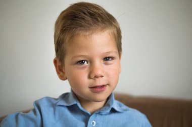 portrait of cute little boy posing at home 